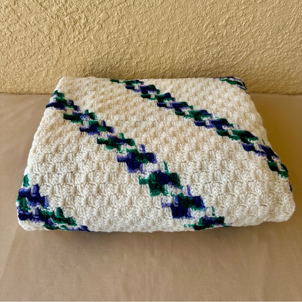 Afghan homemade crochet in cream with accent colors